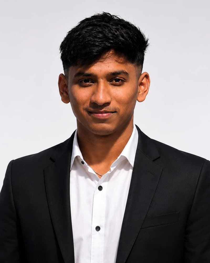 Portrait of Sourabh Mane in a black blazer and white shirt